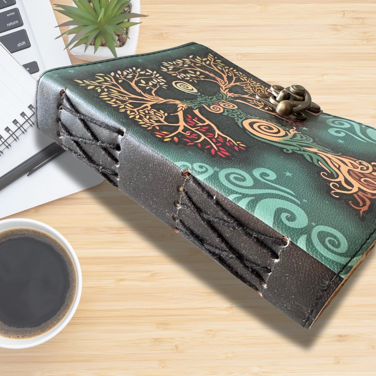 Embossed leather journal on aa asthetic  wooden desk