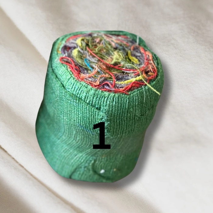 a roll of green Recycled Silk Noil Ribbon