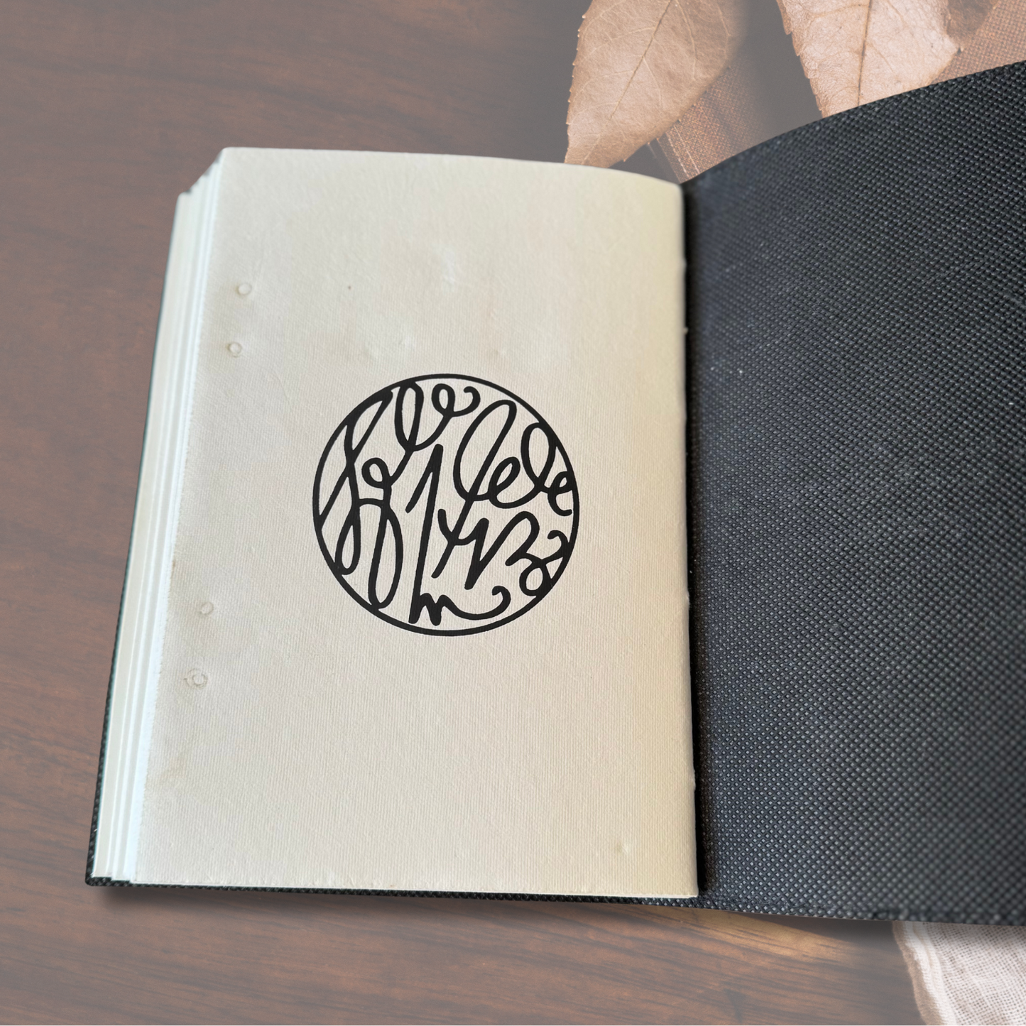 Large Seven Stone Leather Journal showing its last page with black print design circle.