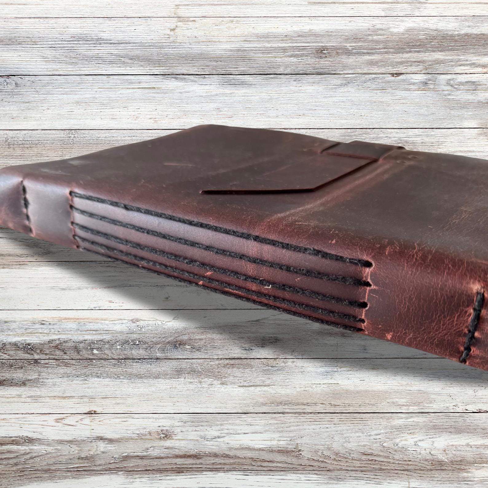 Leather-bound sketchbook for artists on an asthetic background.