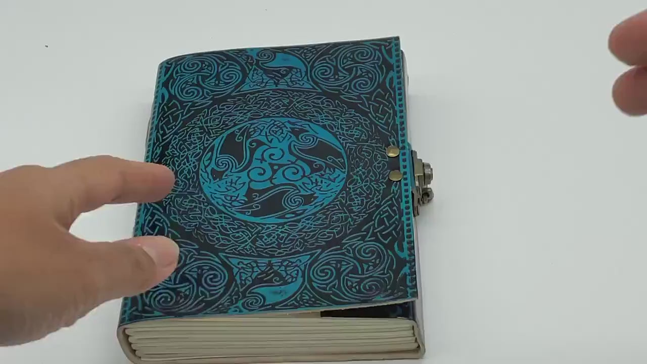 Video showing the Ezra leather journal travel with a brass lock from inside out.