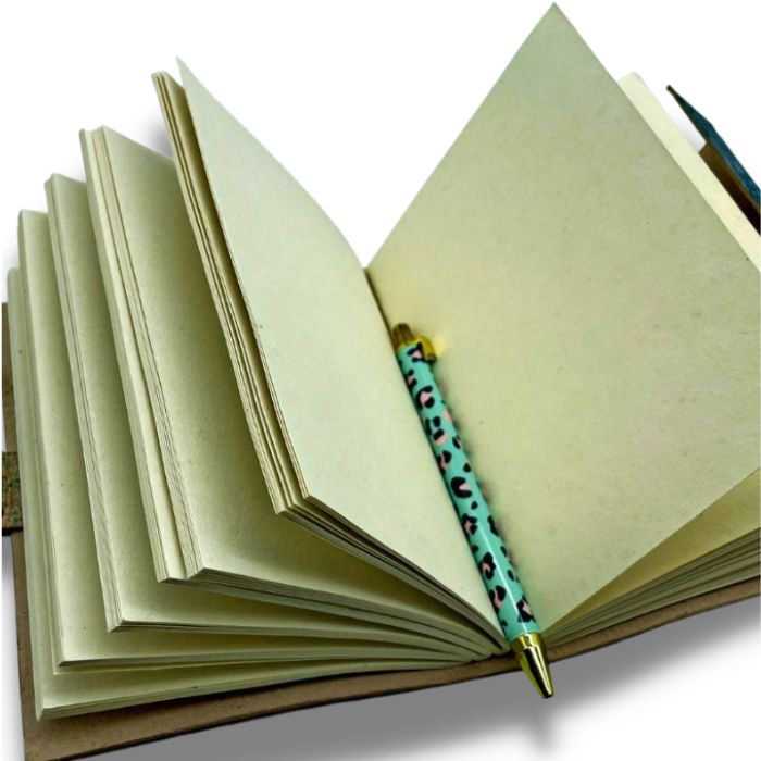 Open Ezra leather journal blank with pen inside