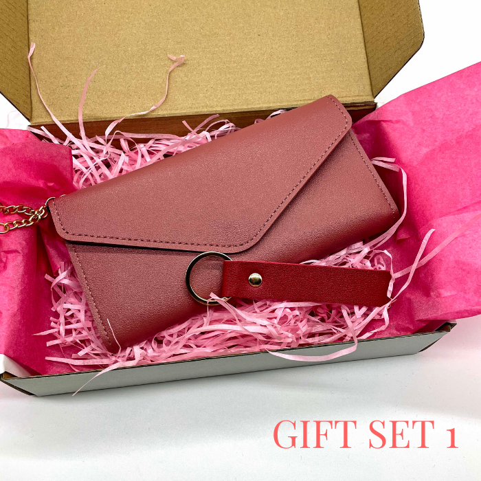 Vibrant Fuchsia leather wallet and leather keychain beautiful packed in a gift box with pink tissue paper and tissue shreds.