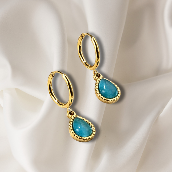 Ellery Minimalist Gold Plated Blue Earrings on satin fabric