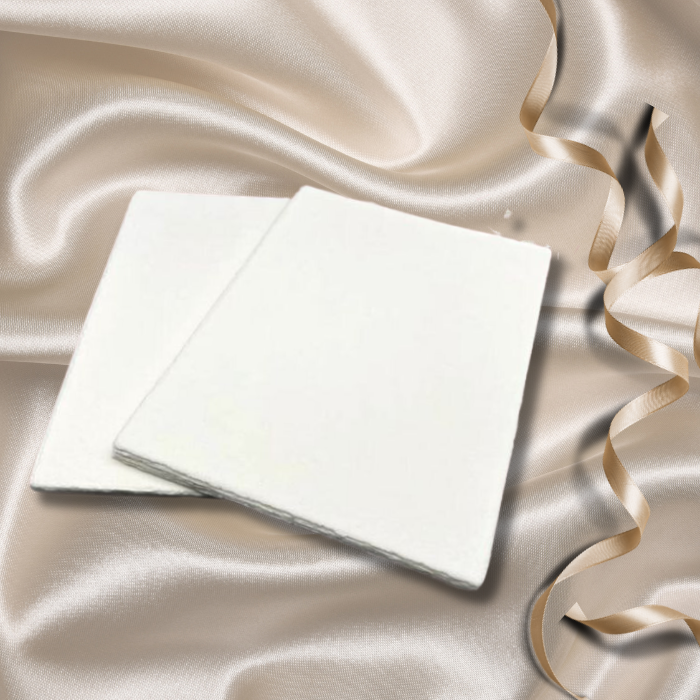 Lyra recycled paper Australia perfect for Wedding Invitations placed on satin fabric background