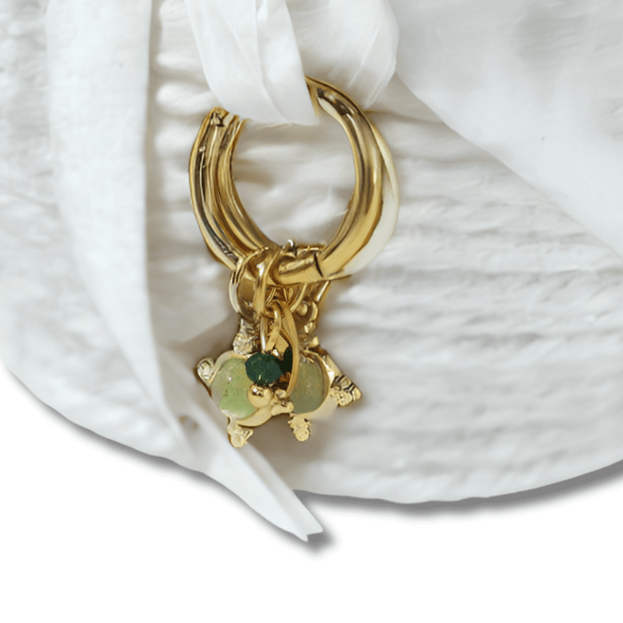 Adira Aventurine 18K Gold Plated Earrings hanging a white ribbon