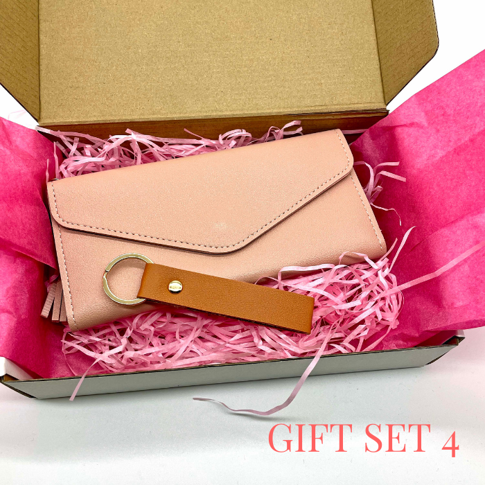 Peachy Pink leather wallet and leather keychain beautiful packed in a gift box with pink tissue paper and tissue shreds.
