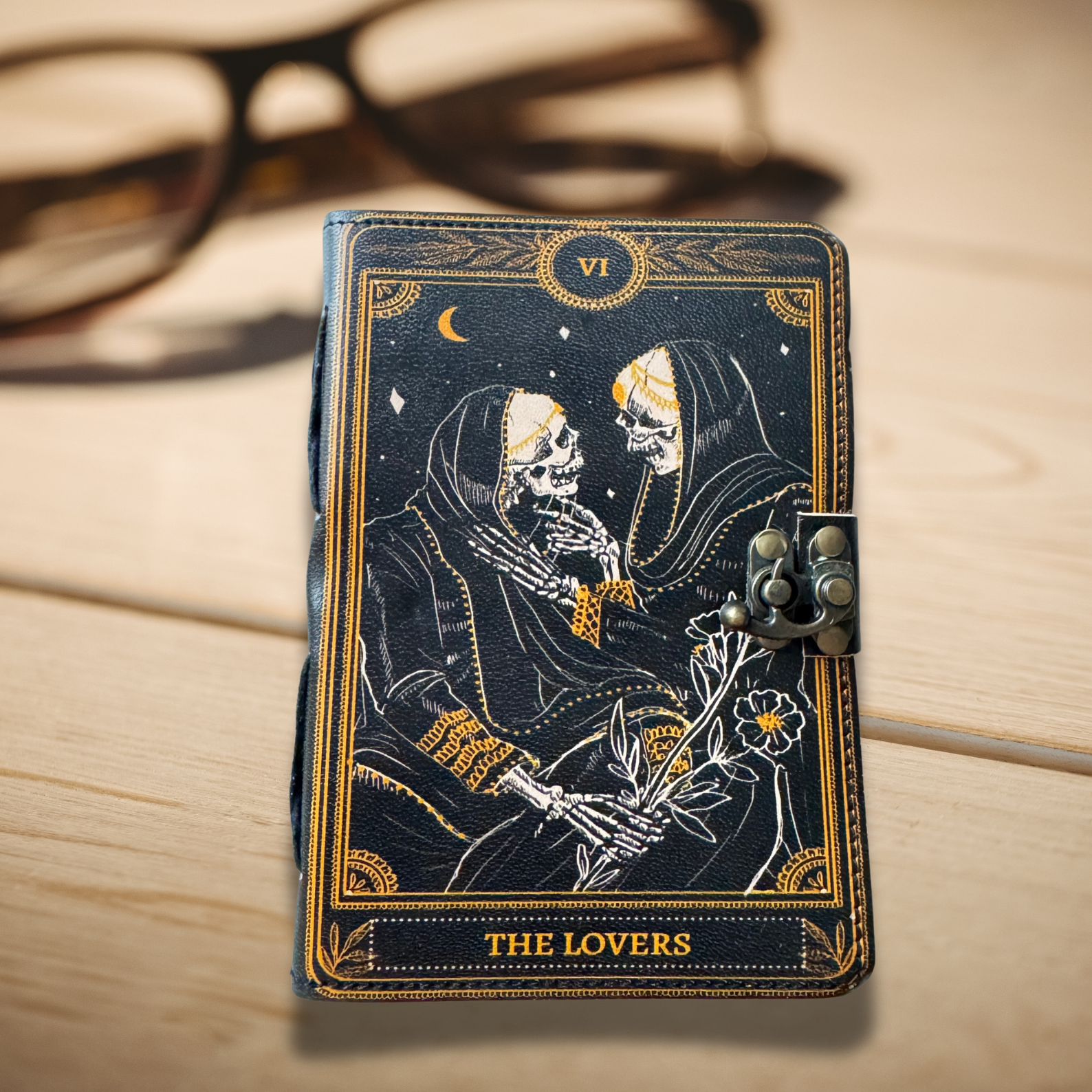 Book Of Shadows on a wooden background with glasses on the side