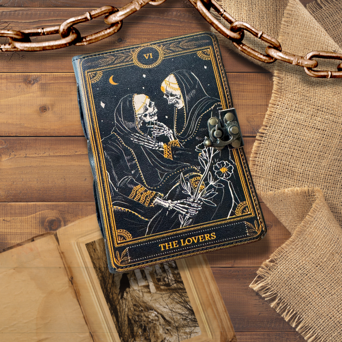 Book of shadows on an asthetic background with a vintage journal and a rustic gold chain