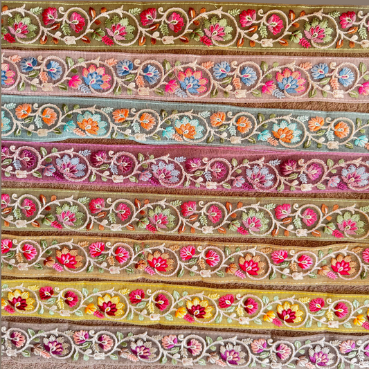 Floral Embroidered Net Trim displayed in different colours