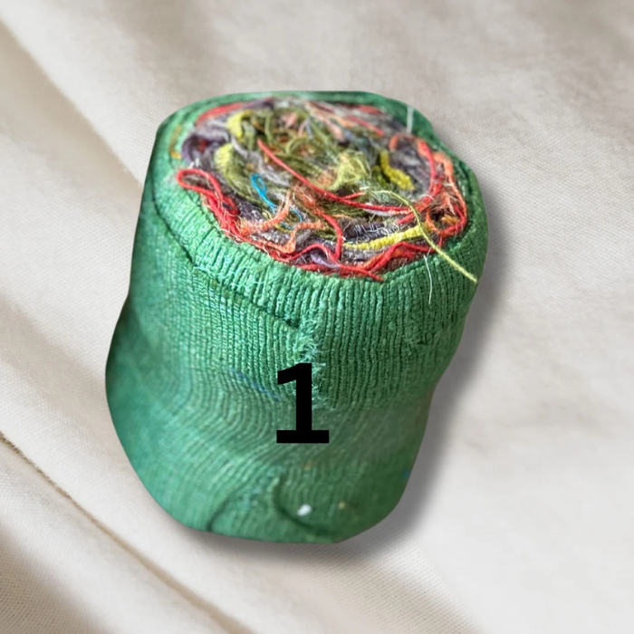 a roll of green Recycled Silk Noil Ribbon 