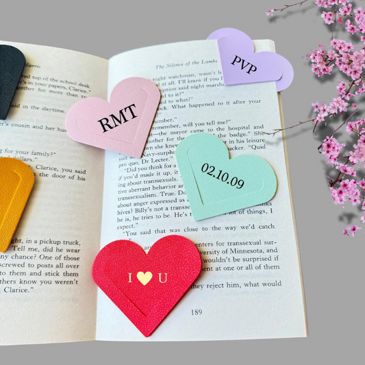 Heart corner bookmark with personalisation placed on a book