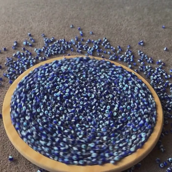 A video showing Handmade Evil Eye Beads 5mm for quality and size