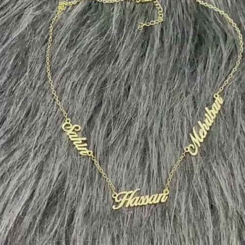 A video showing the Adele Multiple Name Necklace in gold closely.