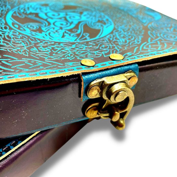 Close up of  Ezra blue leather journal travel with close up of brass lock