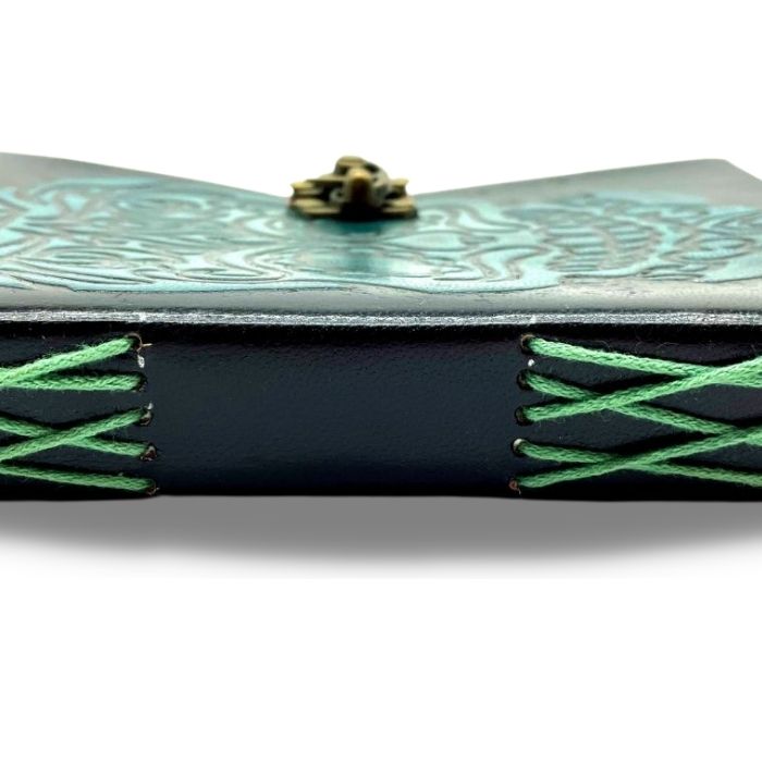 Draven bound leather journal with close up showing hand stitching of the journal in green